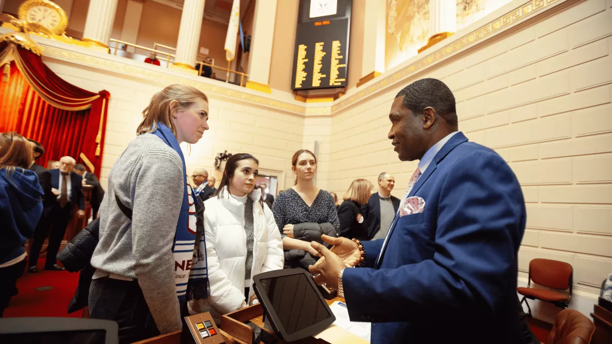NEARI members on the House floor speaking with Rep. Biah