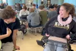 Break the Myth video still of two students smiling at each other