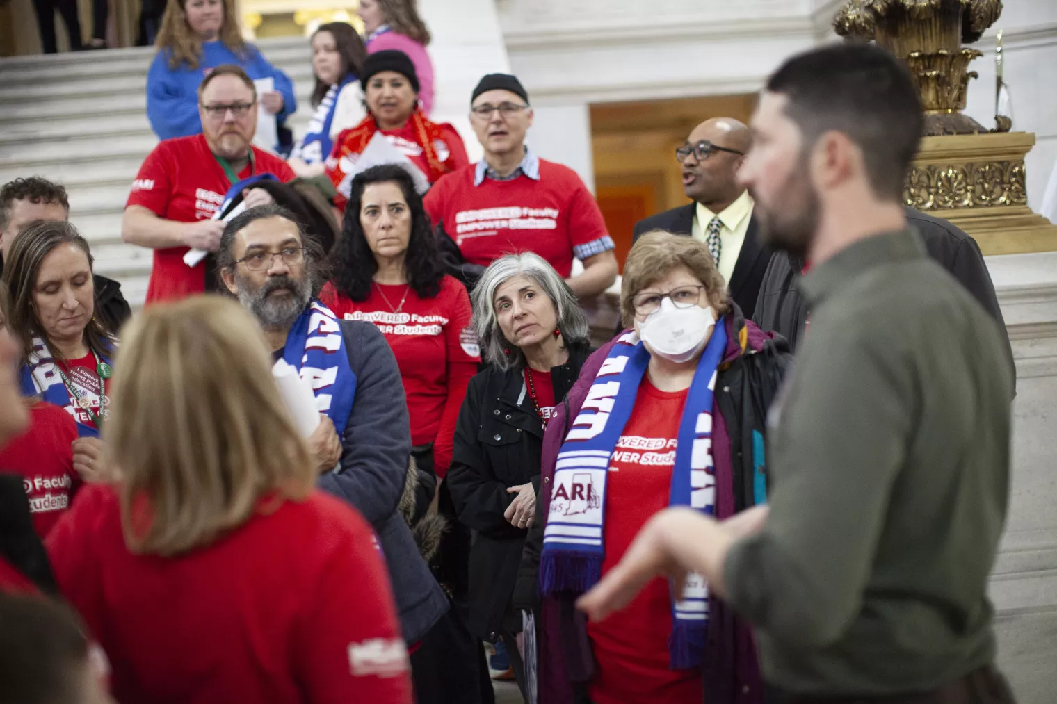 NEARI CCRI members having discussion on Capitol steps at Lobby Day 2024.
