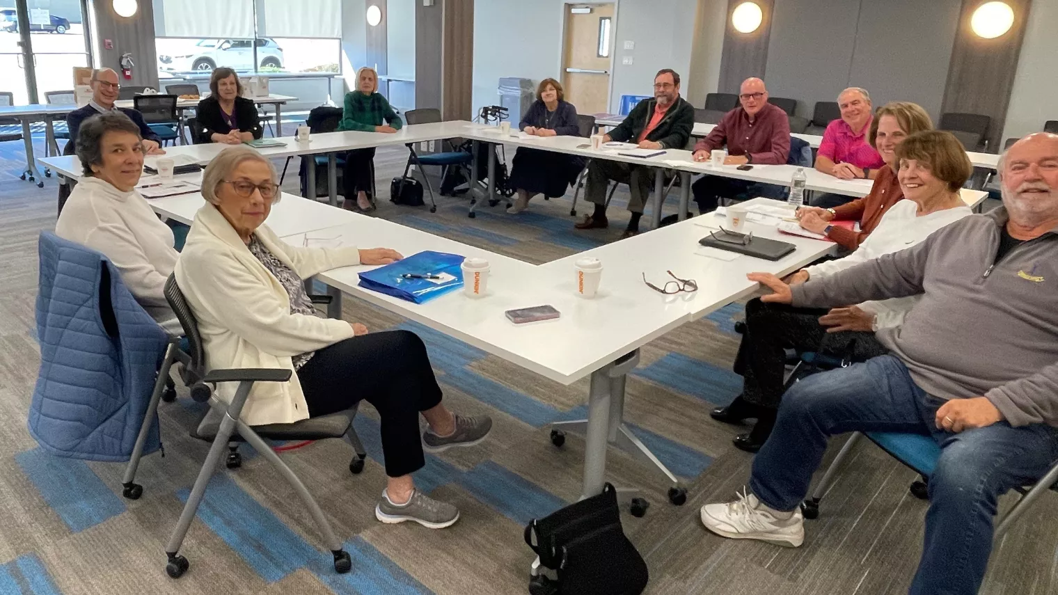 Large table with people in a meeting
