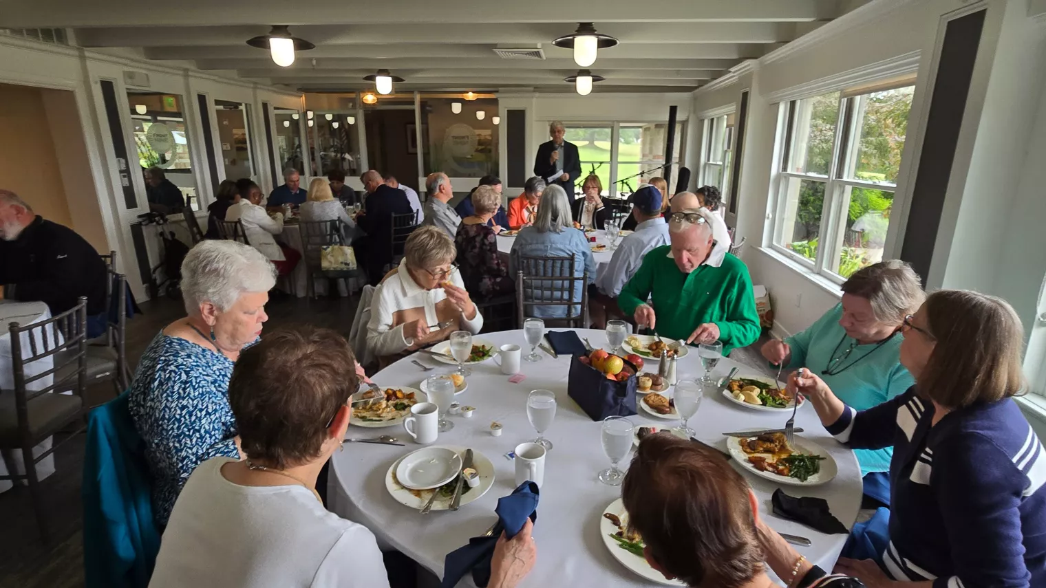 Large group of people eating dinner