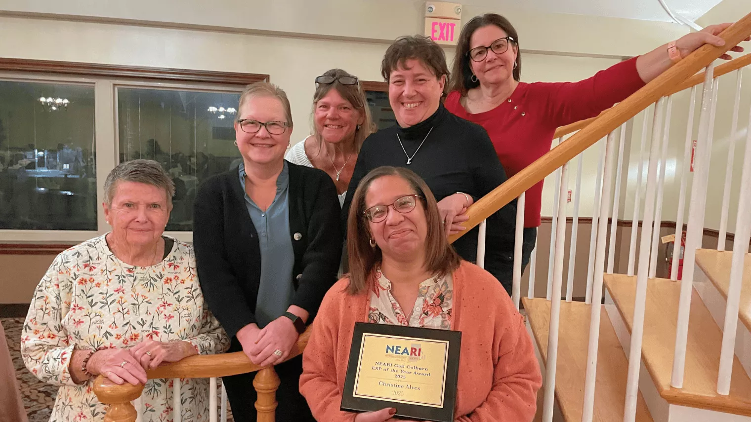 Six women smiling together