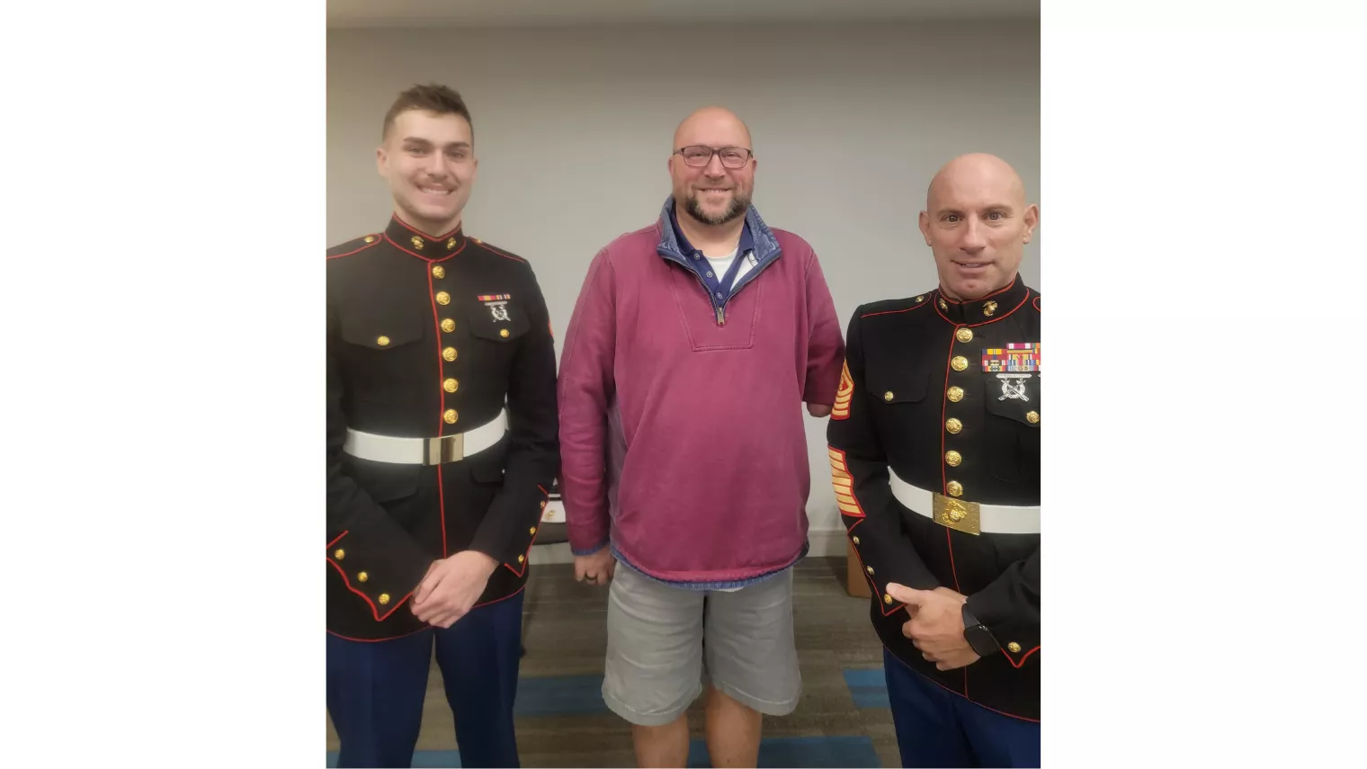Vin Levcowich standing with US Marine Reservists at Toy Drive