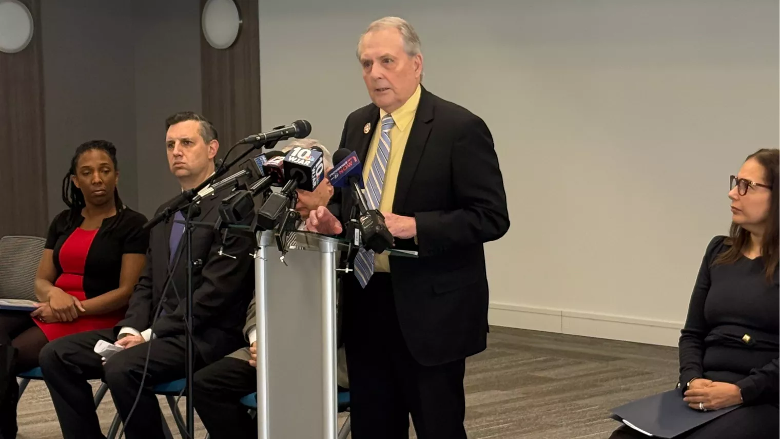 RIC President Jack Warner at podium