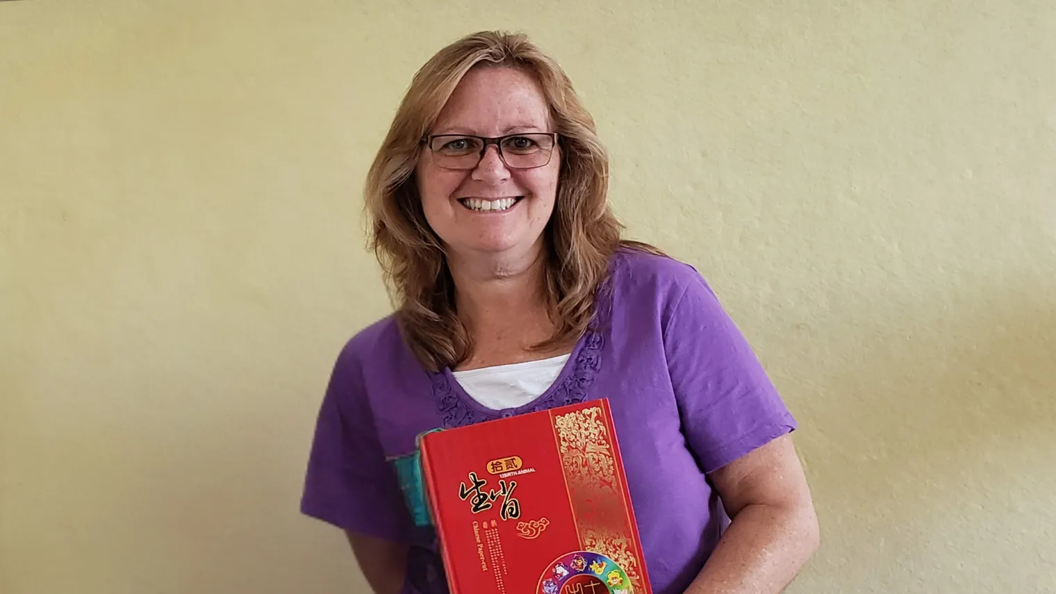 Lisa Tvenstrup smiling with book