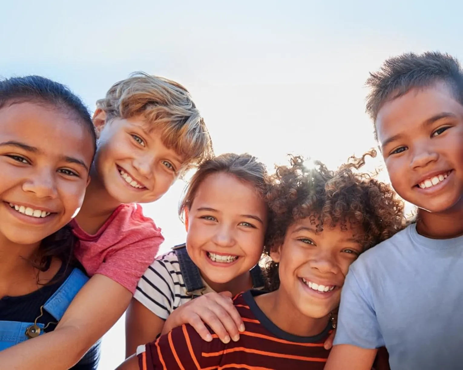 five smiling children