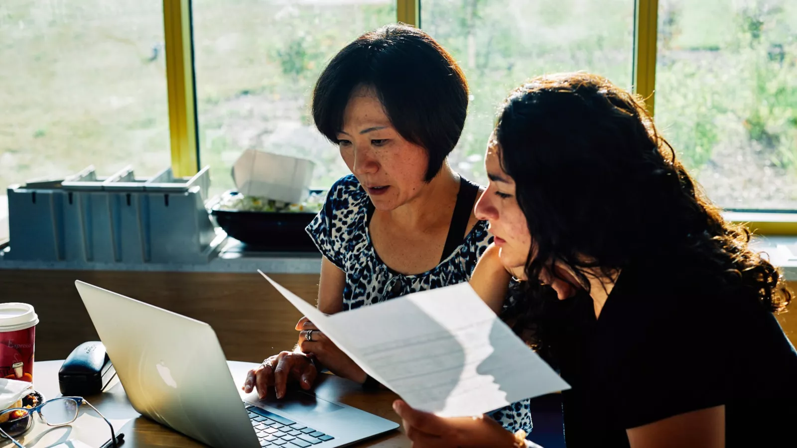 Members review a contract together