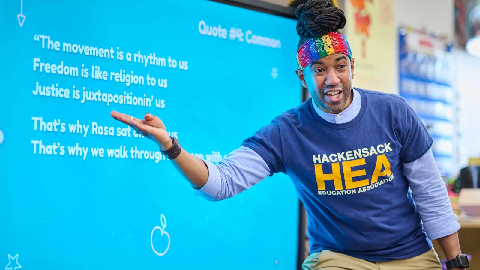 Toney Jackson at the display board demonstrating rap music.