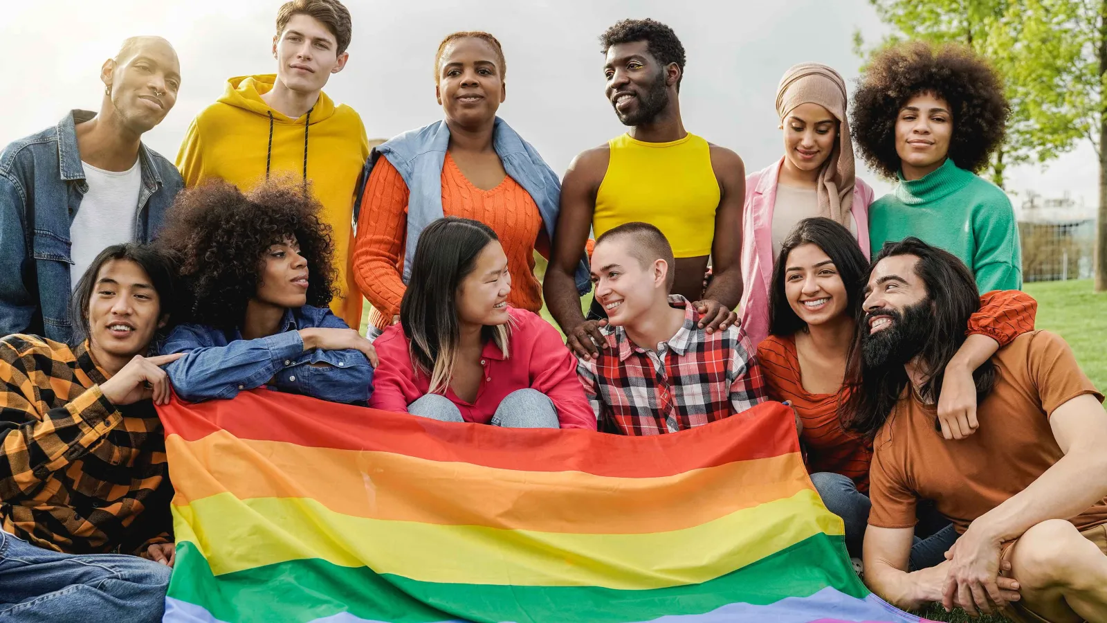 Group of students with rainbow flag