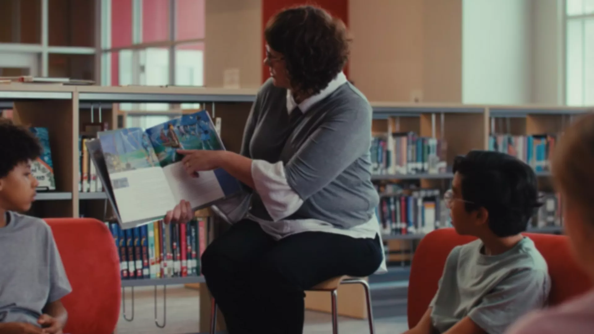 Librarian reads to children