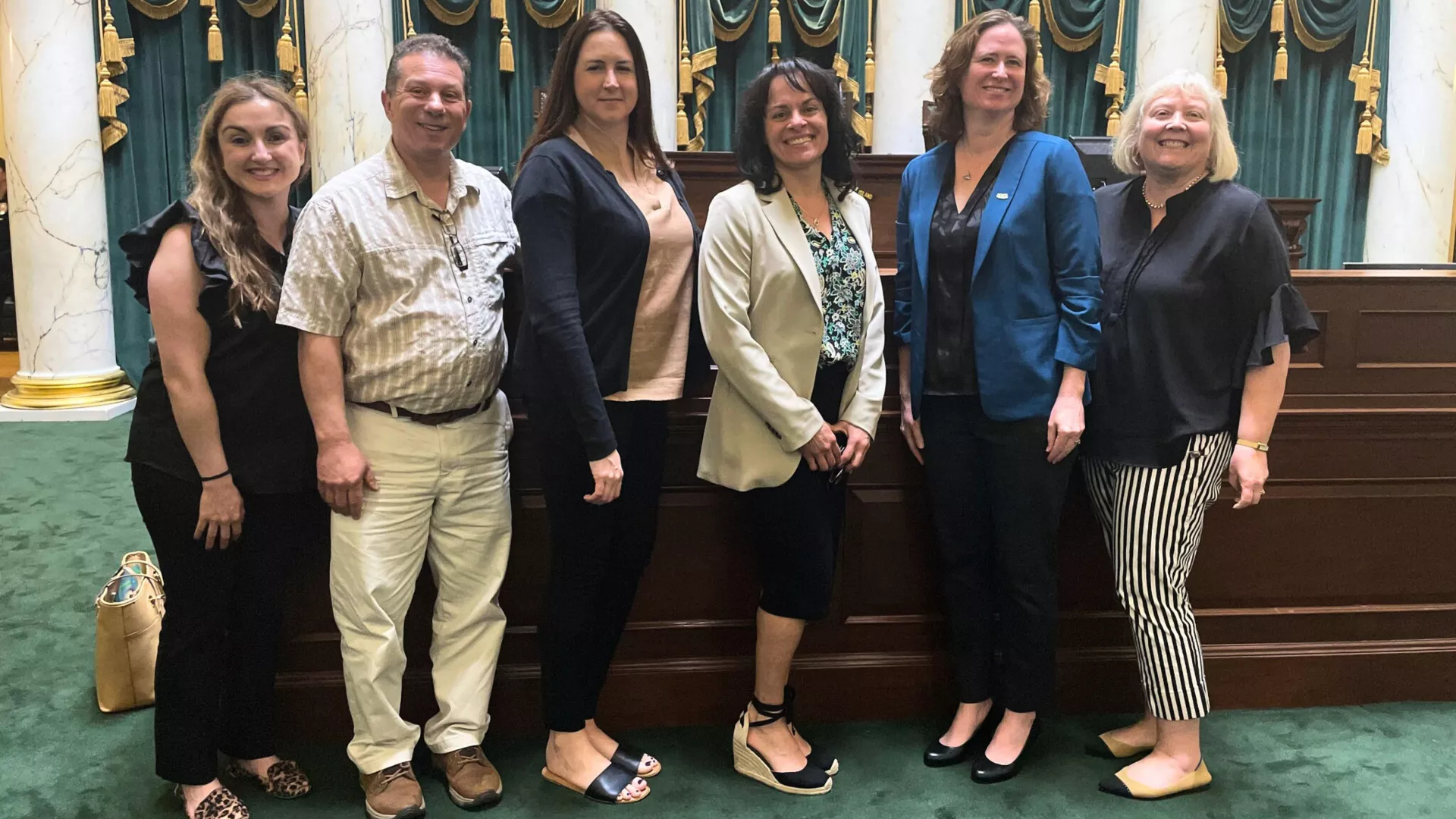 NEARI members pose for a picture at the Capitol after testifying on legislation.