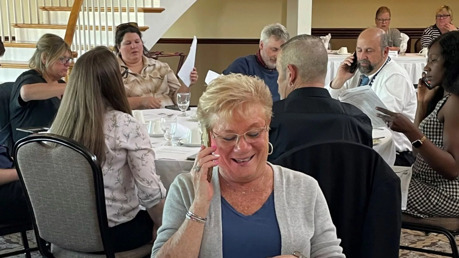 NEARI members at a dinner are all calling legislators on their cell phones.