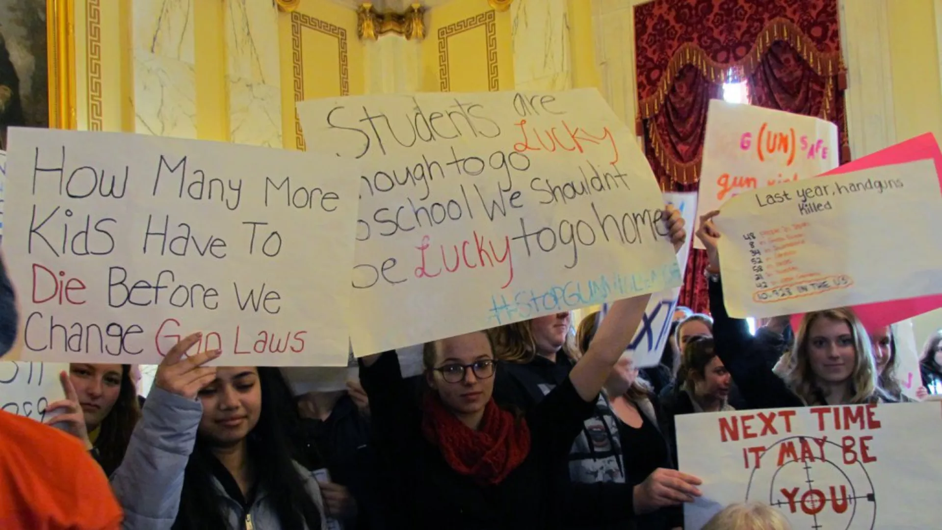 signs at the 2018 statehouse rally against gun violence.