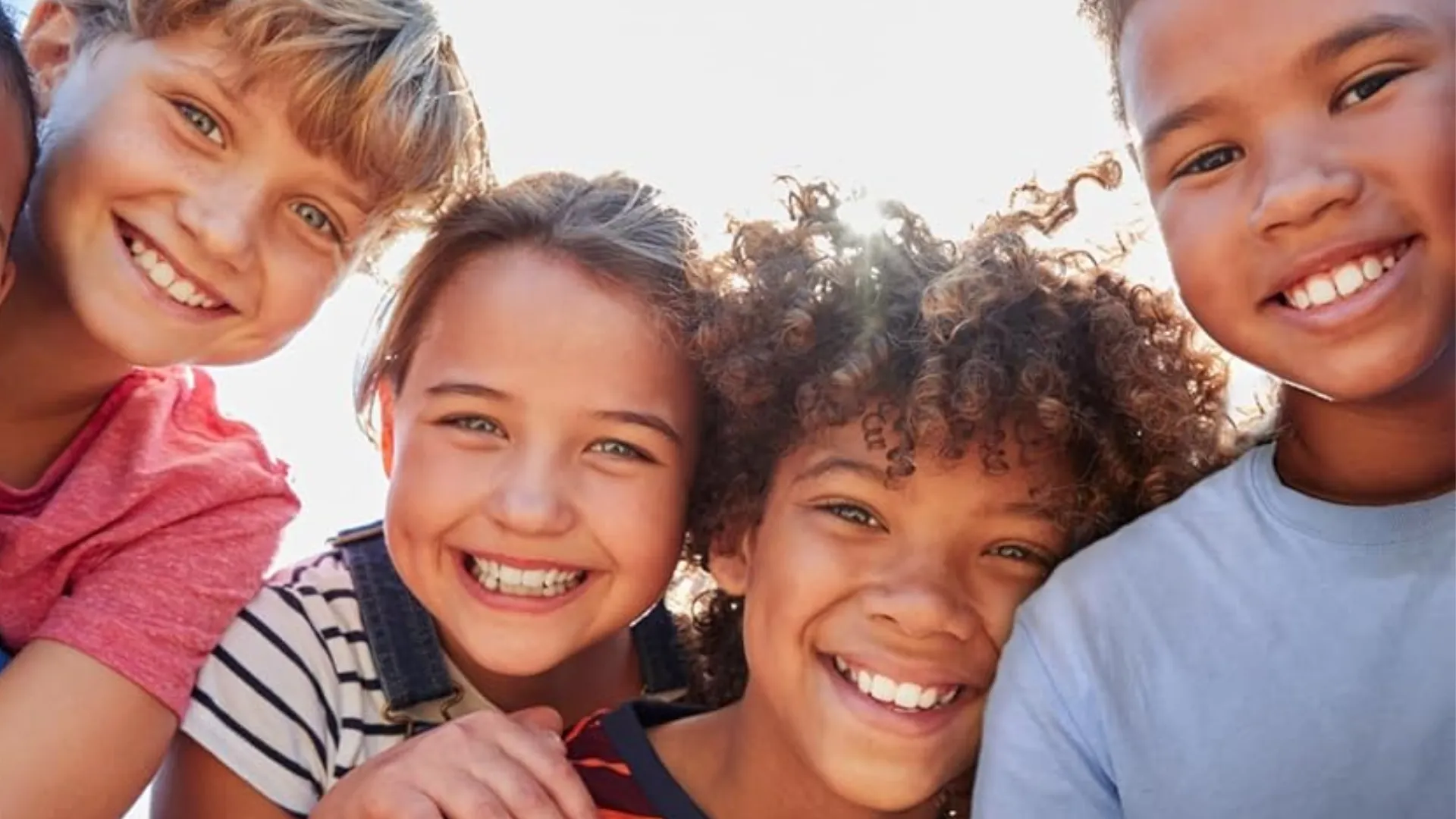 four smiling children