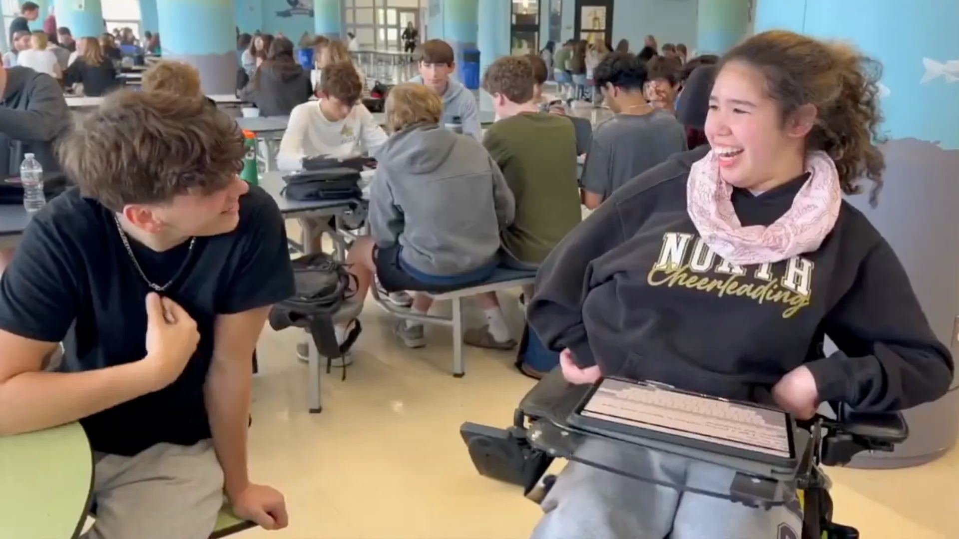 Break the Myth video still of two students smiling at each other
