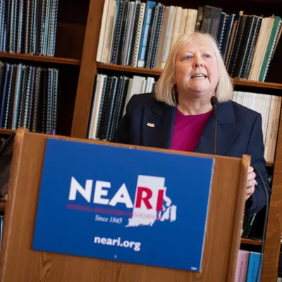 Val Lawson speaking at a podium