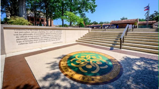 A picture of the stairs outside the King Center with the logo printed on the sidewalk.