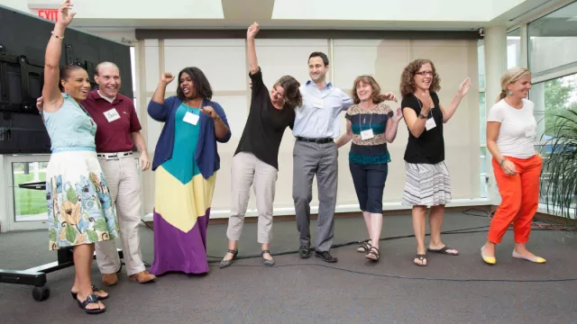 Teachers cheer at a PD