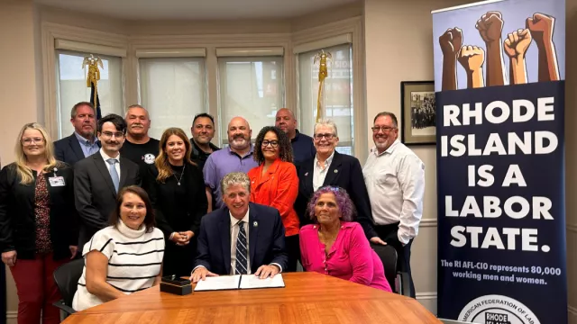 State and Municipal employees with the state coalition Governor's signing