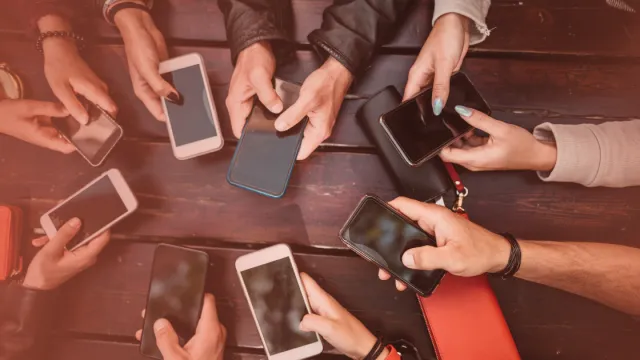 Hands holding cellphones