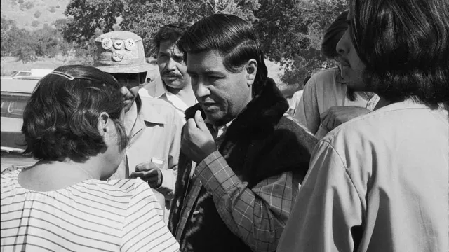 Cesar Chavez speaks to workers outside