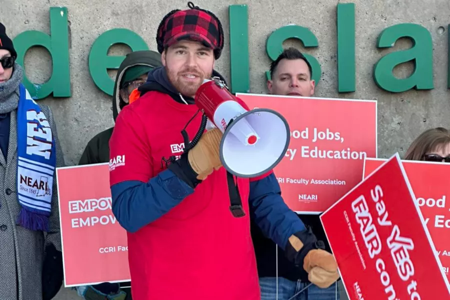 One man speaks into the bullhorn as CCRI Members picket for a fair contract.